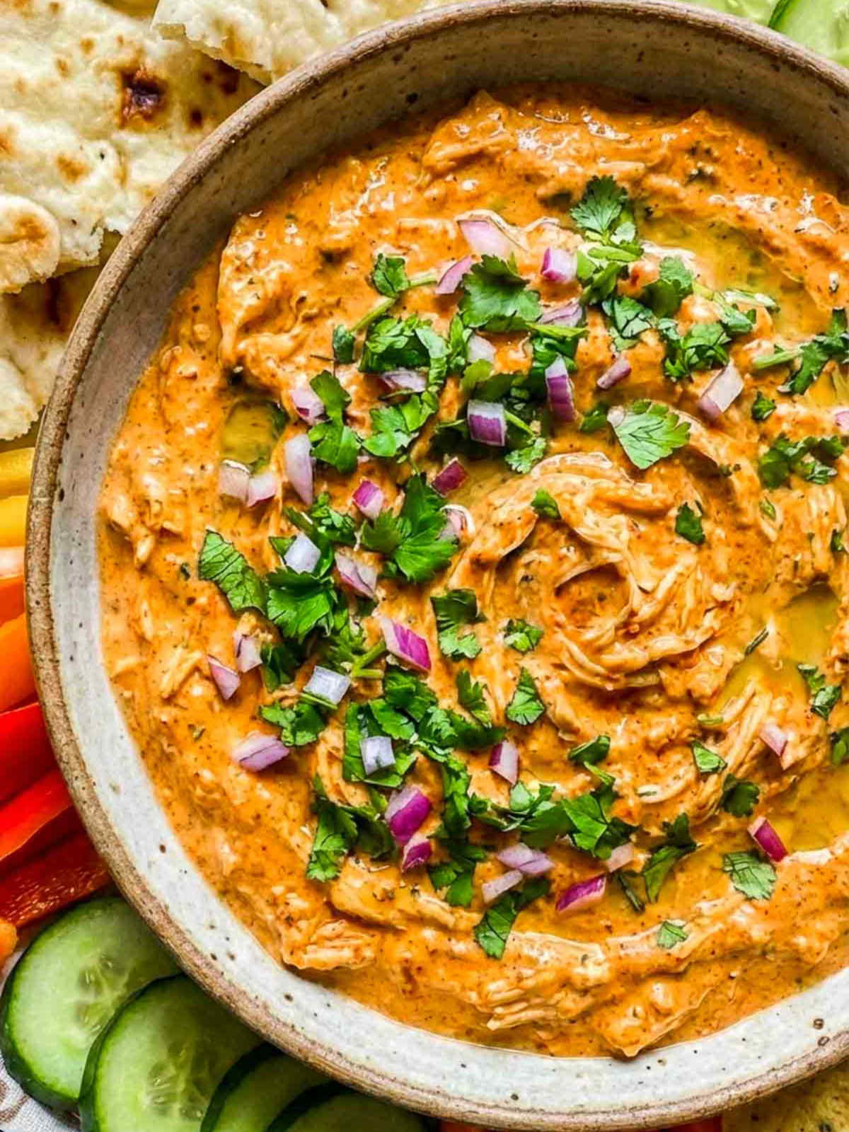 Close up of tandoori chicken dip showing the creamy texture.