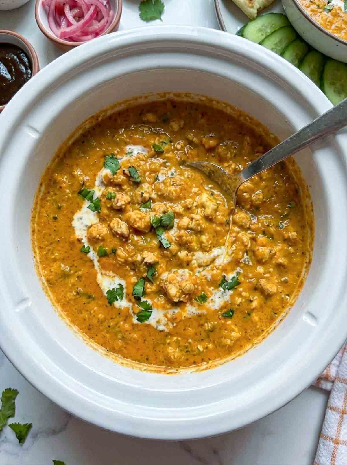Cloe up of butter paneer dip inside a crockpot.